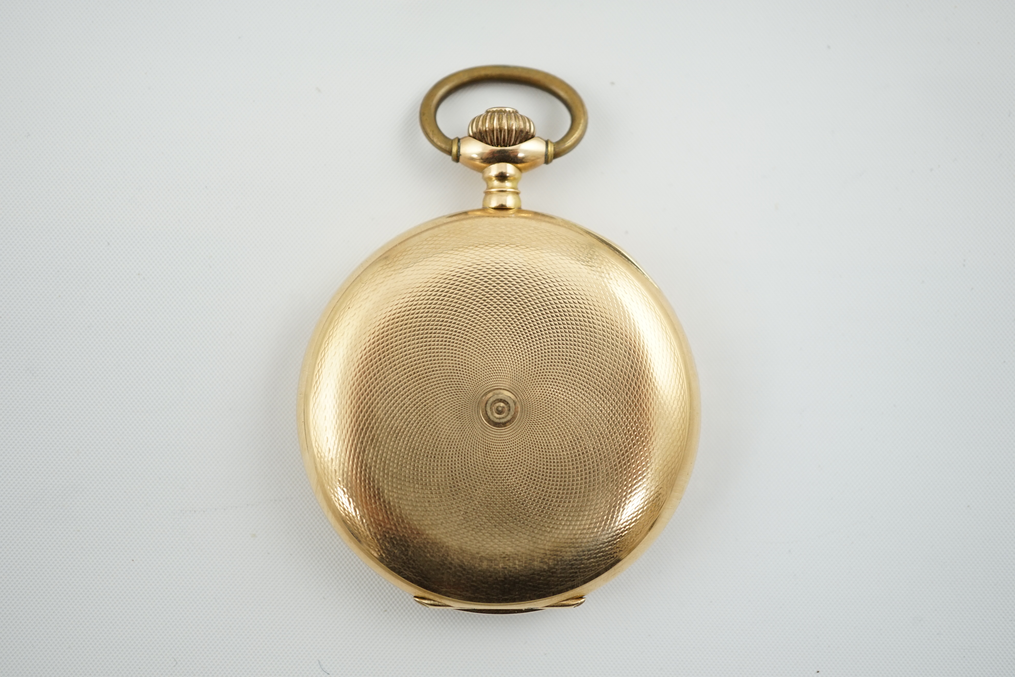 An early to mid 20th century Swiss engine turned 14k gold keyless lever hunter pocket watch